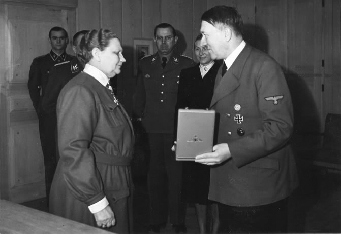 Adolf Hitler awards  Fanny Luukkonen, leader of the Finnish Lotta Svärd, a voluntary auxiliary organisation for women, with the Order of the German Eagle with Star